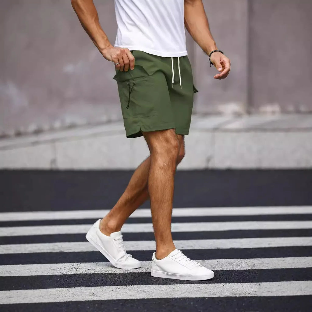 Men's loose fit work shorts in army green with straight leg design and fifth pants length