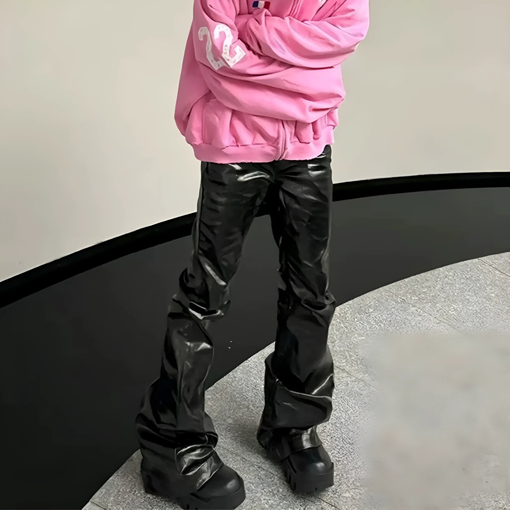 Black patent leather coated skinny jeans with straight leg silhouette and mid waist design