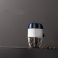 Coffee cup shaped car air freshener in various colours providing fragrance and odour removal.