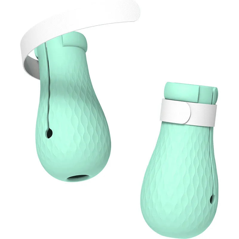 Four green silicone cat paw scratch protection covers for pet grooming.