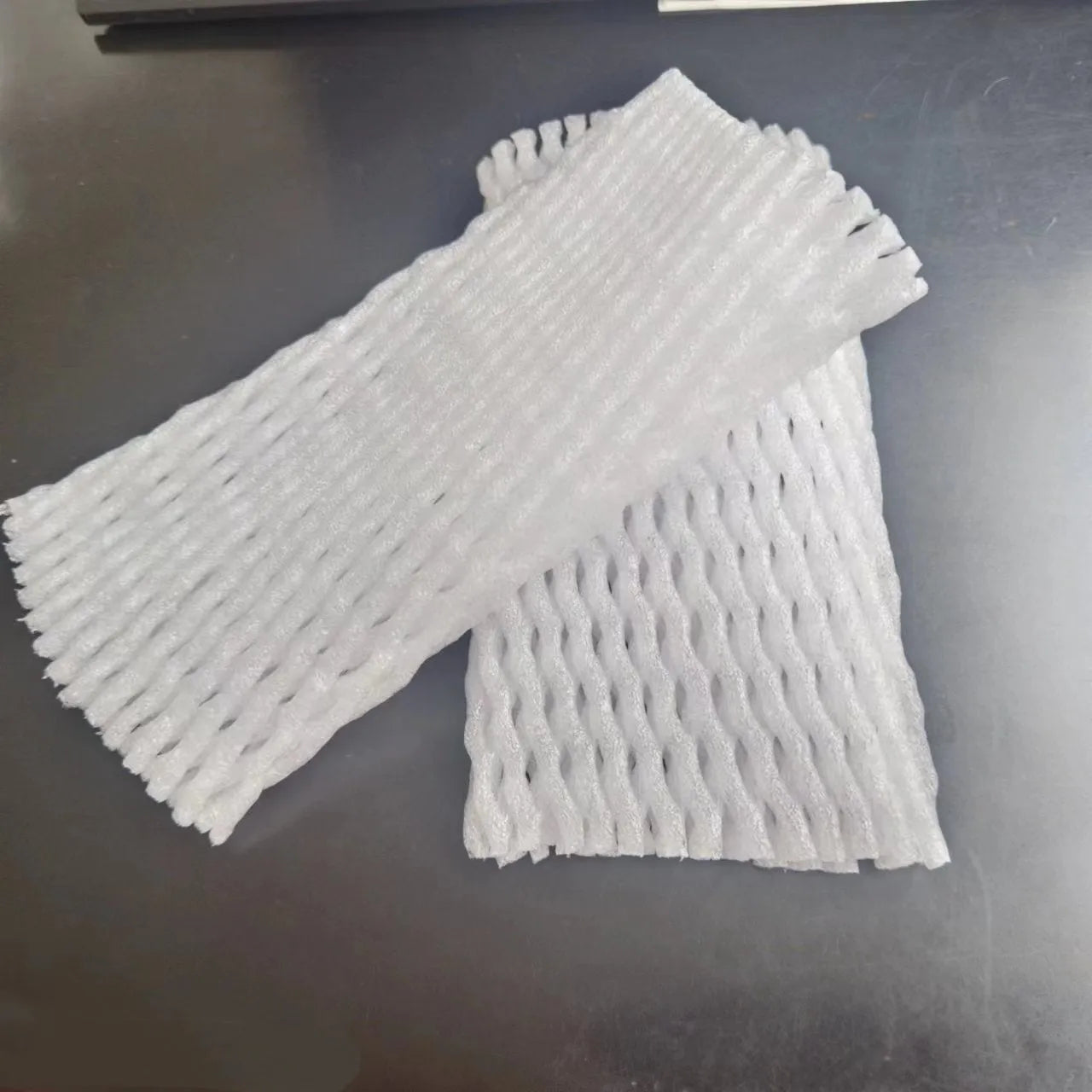White foam fruit net protective cover with hybrid construction for shockproof fruit safeguarding