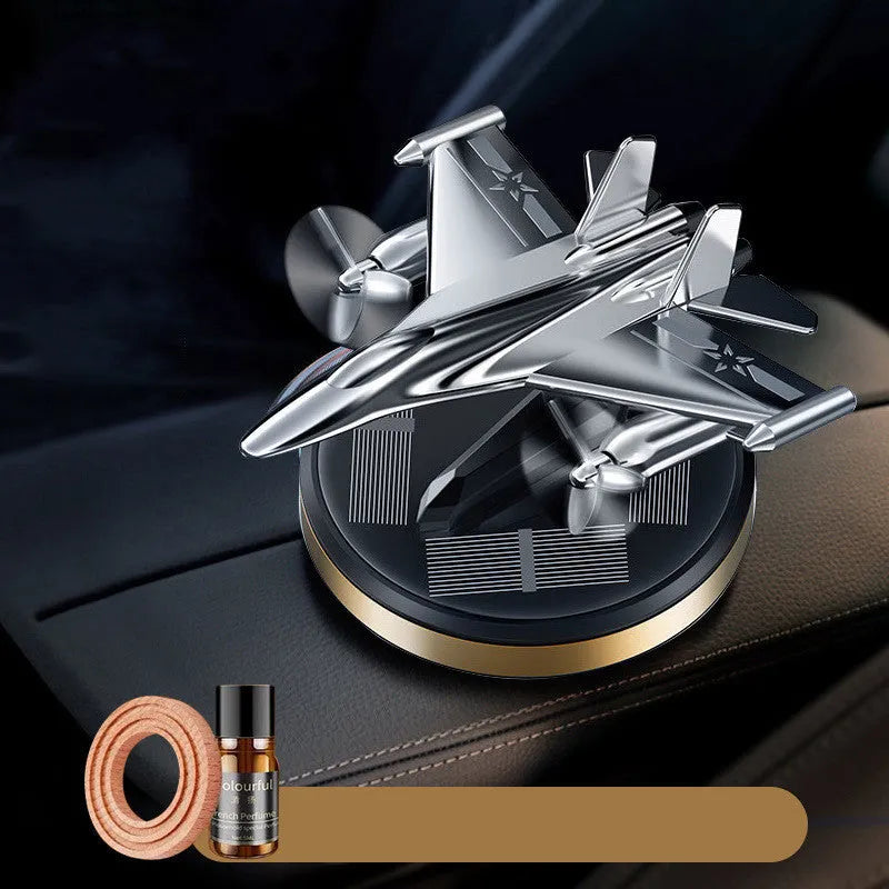 Solar-powered rotating fighter jet perfume ornament in silver, gold, blue, and red colour options