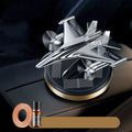 Solar-powered rotating fighter jet perfume ornament in silver, gold, blue, and red colour options