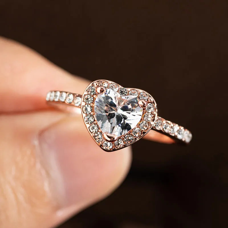 Heart-shaped crystal wedding ring with electroplated rose gold finish on white copper band