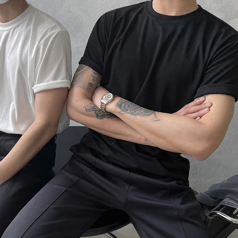 Men's slim fit cotton half sleeve t-shirt in black, showing round neck and regular sleeve design.