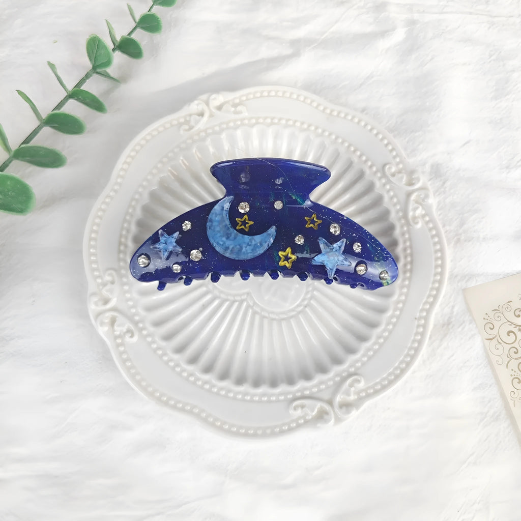 Oversized star moon barrettes with starry sky patterns in cellulose acetate material