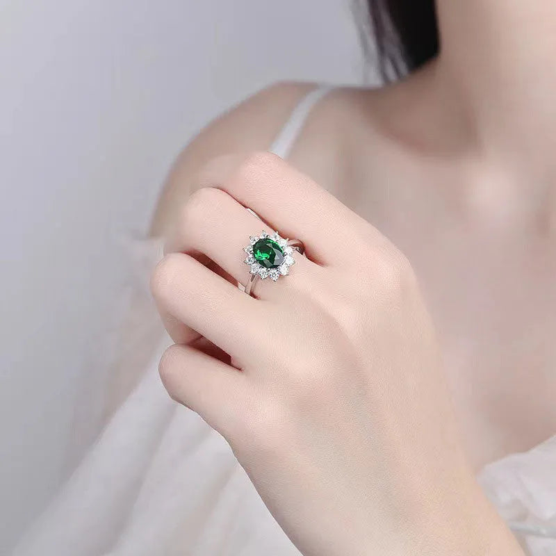 Women's electroplated copper ring with a blue zirconium flower stone on a finger.