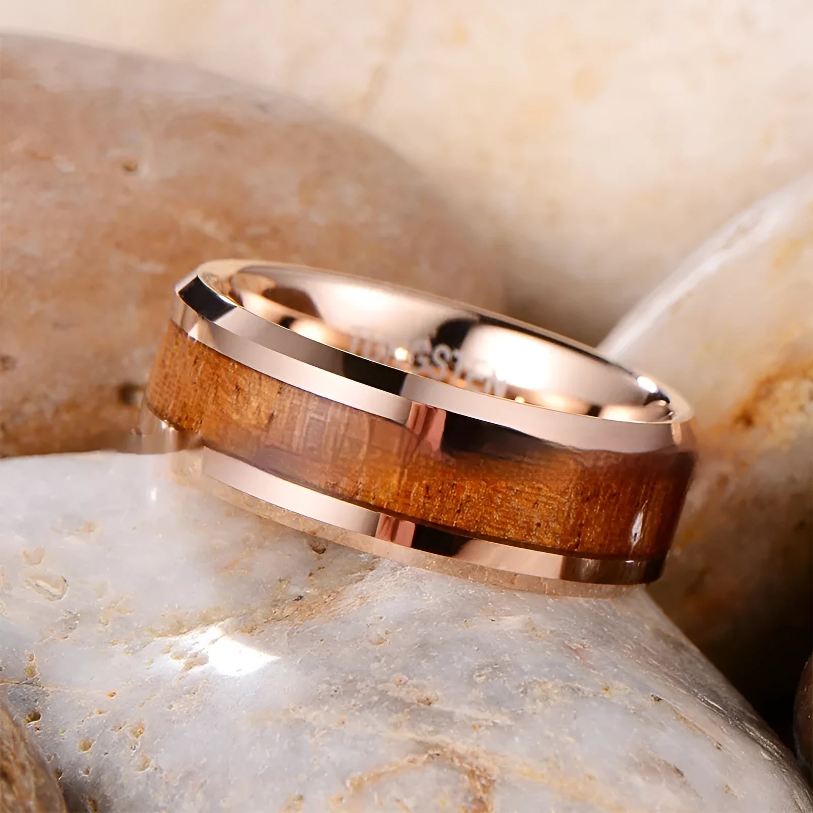 Ugyen men's tungsten ring with wood and leather inlay in 8mm width on a hand.