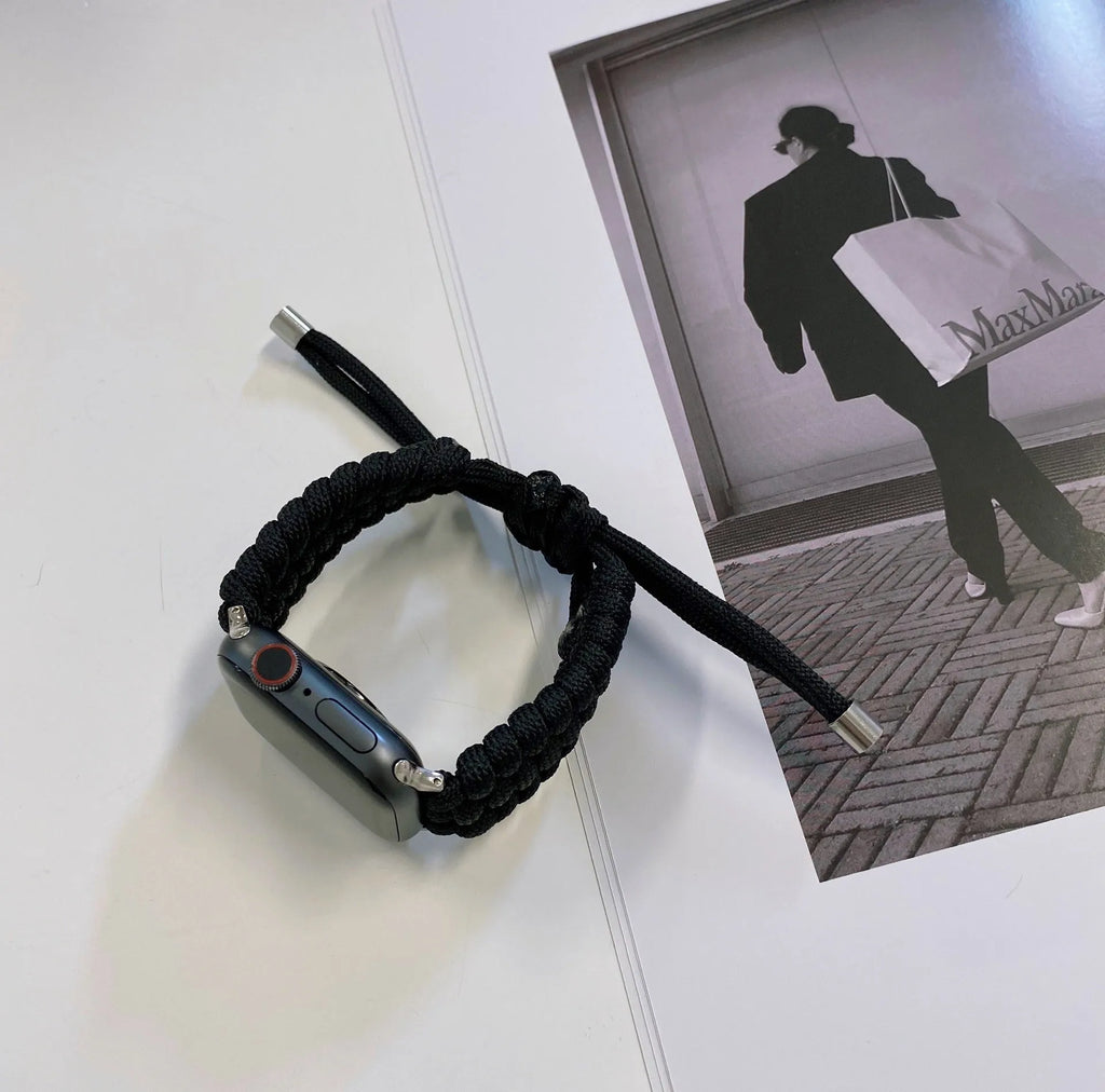 Black paracord braided smart watch strap with common raw ear lugs for Apple and Samsung watches.