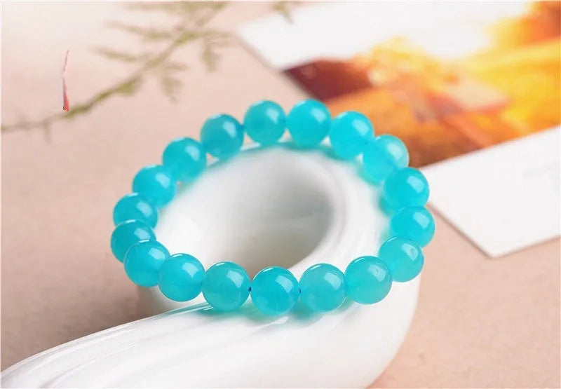 Grade 7A Amazonite natural scattered beads in ice colour showing polished surface and size variations