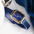 Square rose gold casual watch with black dial and black leather strap showing 8mm thickness