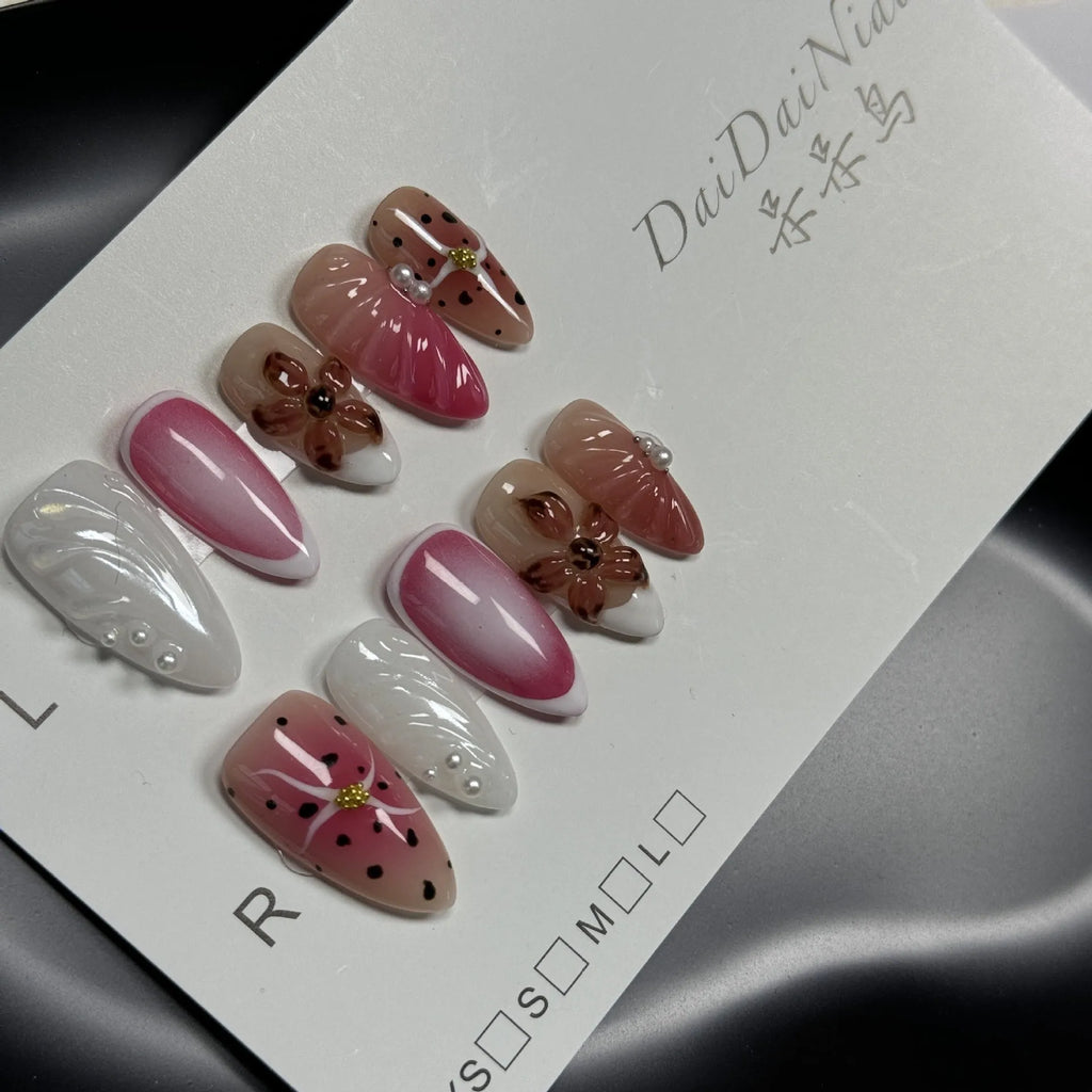 Hand-painted 3D carved nail art patches in embossed candy colours for almond-shaped nails.