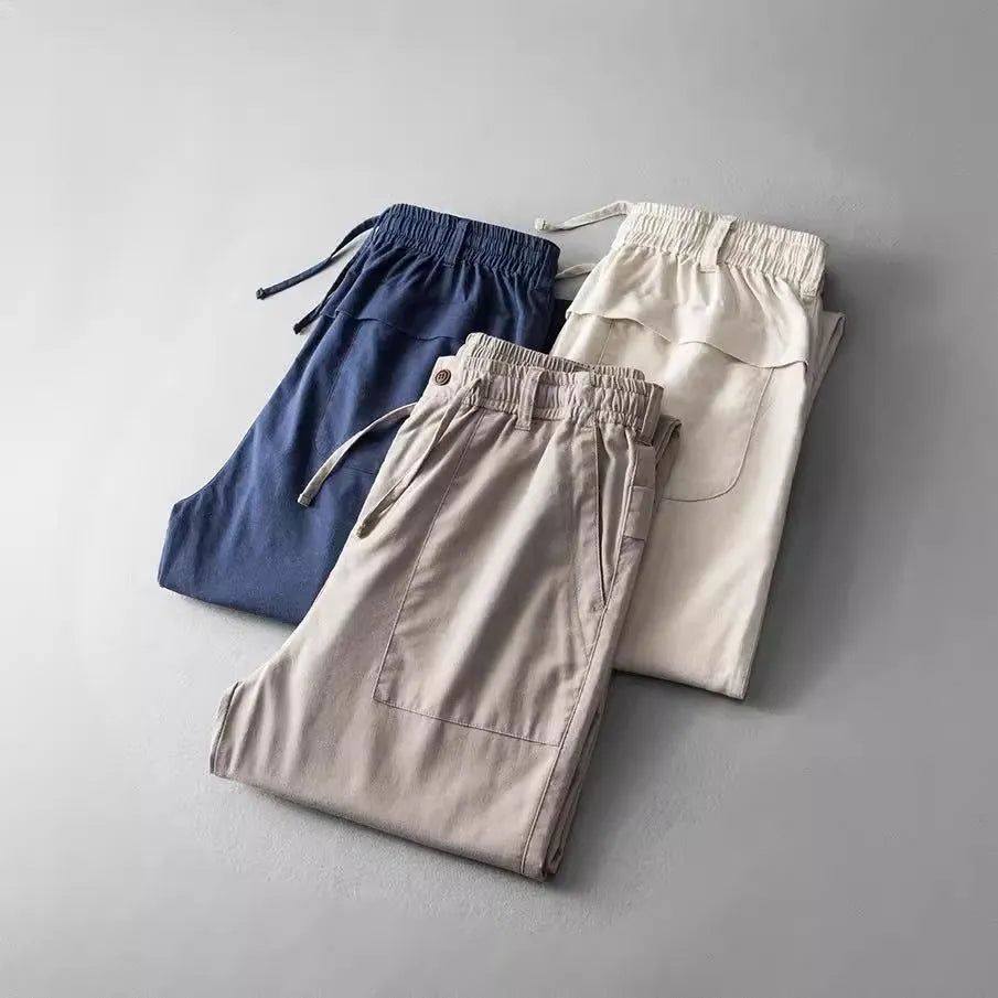 Men's linen casual trousers in navy blue, apricot, and grey colours with mid waist design