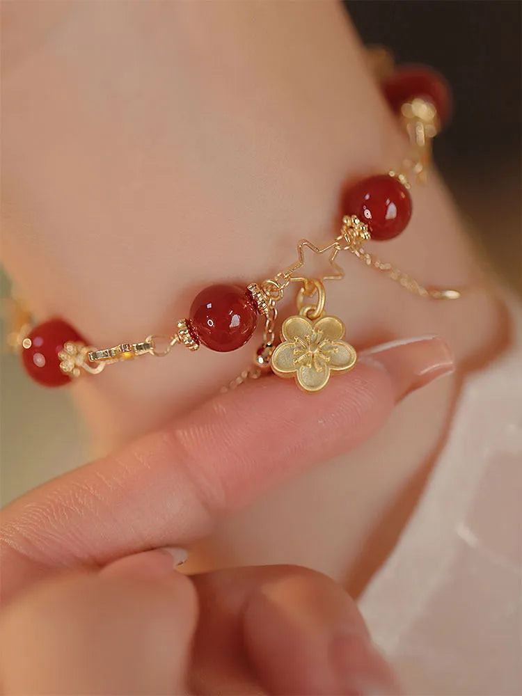 A red agate double layer bracelet with floral details for women.