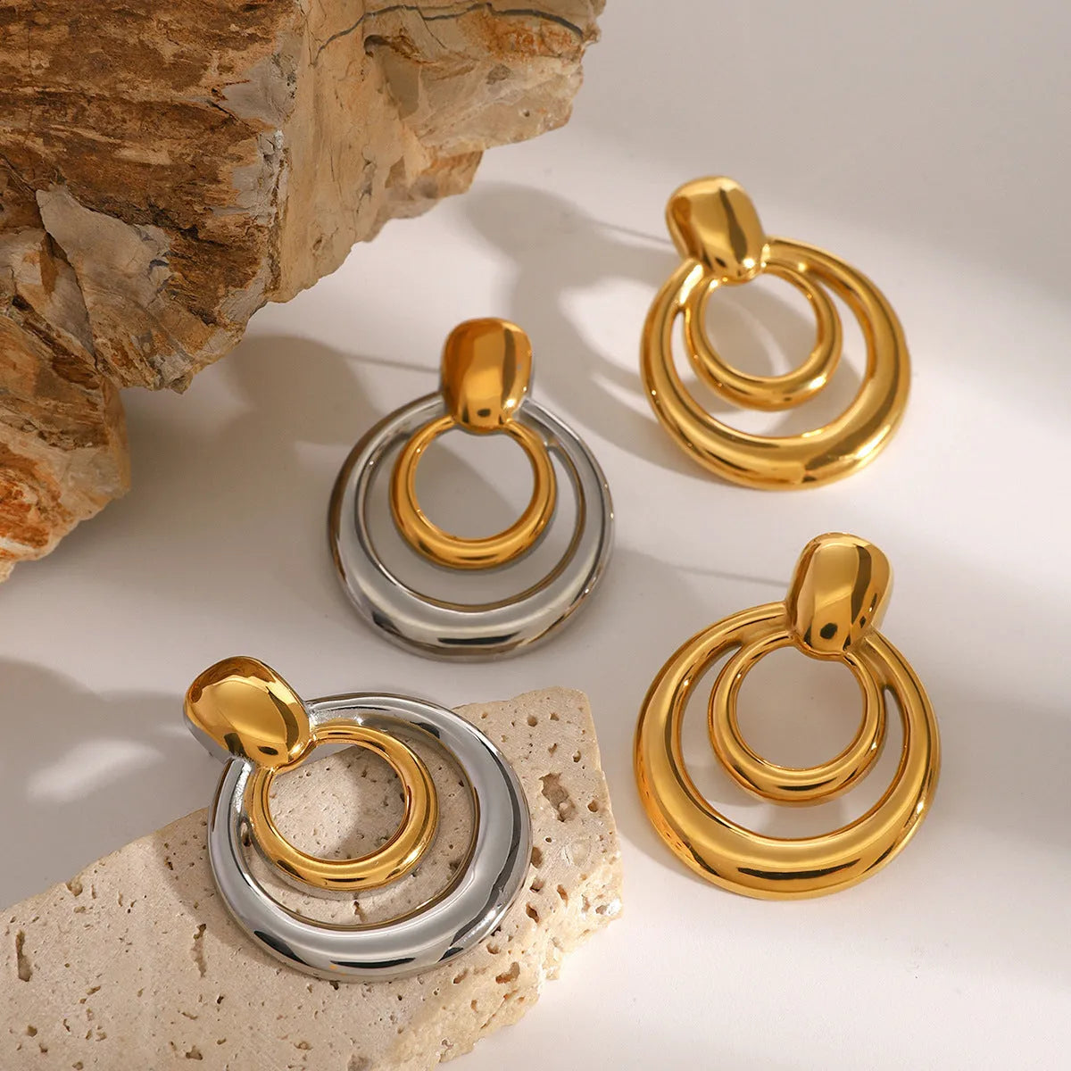 Golden round double layer hollow stud earrings with geometric design and electroplated finish