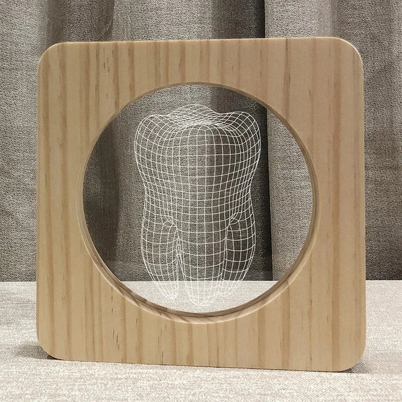Square tooth-shaped wood colour acrylic night lamp with USB cable on a desk.