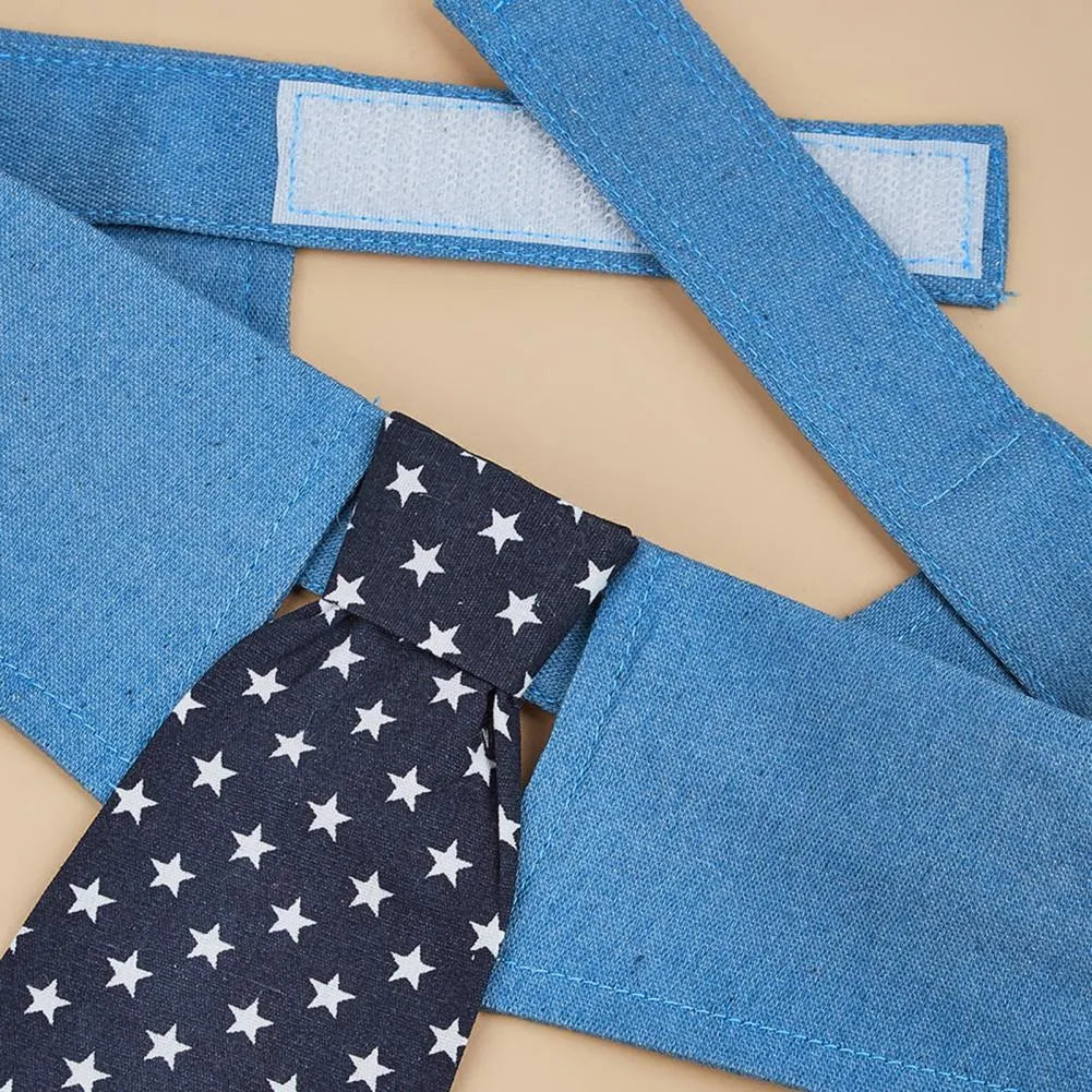 Denim dog collar with an attached red star pattern necktie, showing the adjustable fastener tape closure.