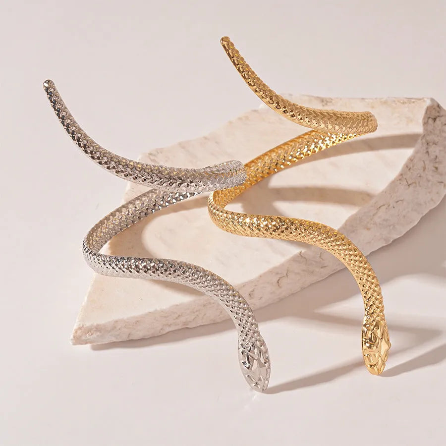 Gold twisted snake ring and bracelet set with exaggerated winding design