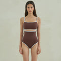 Brown women's one-piece swimsuit with a triangle top on a mannequin.