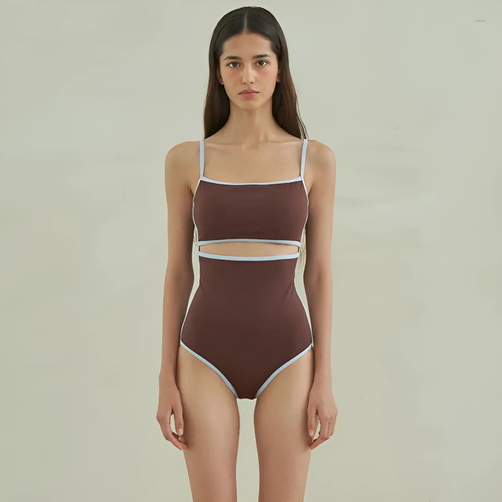 Brown women's one-piece swimsuit with a triangle top on a mannequin.