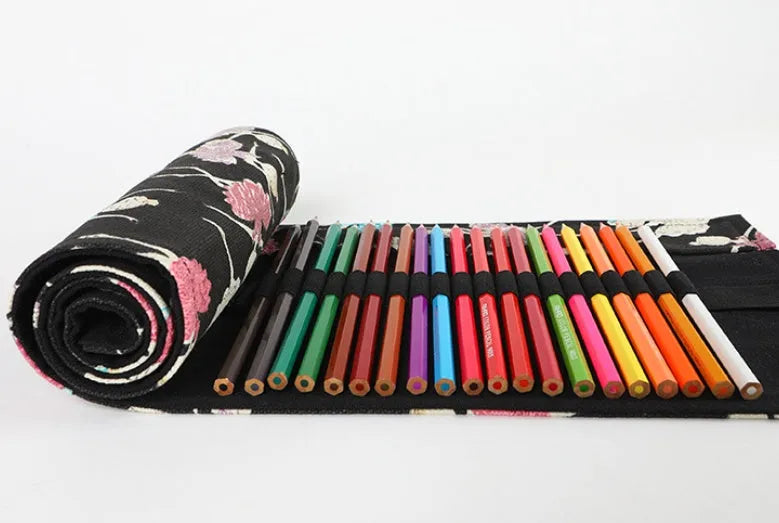 Rolled-up canvas pencil case with ballet girl print, showing multiple pencil slots.