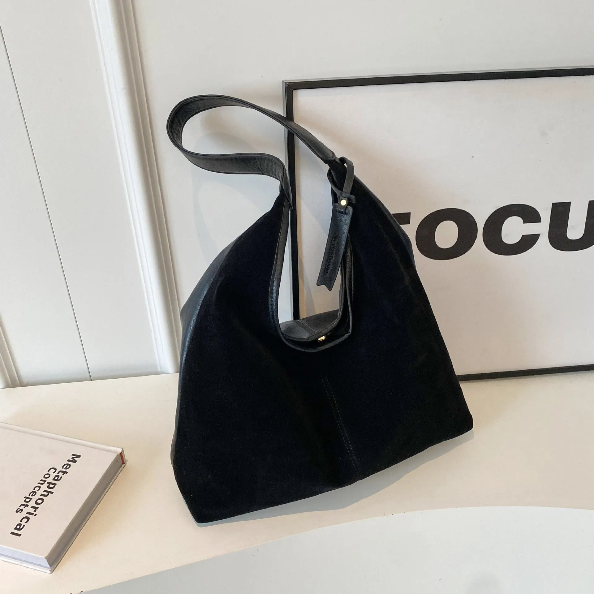 Retro PU shoulder bag with suede stitching and bucket shape in brown colour