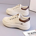 Women's white Korean-style lace-up shoes with cross-strap detailing and flat mid heel
