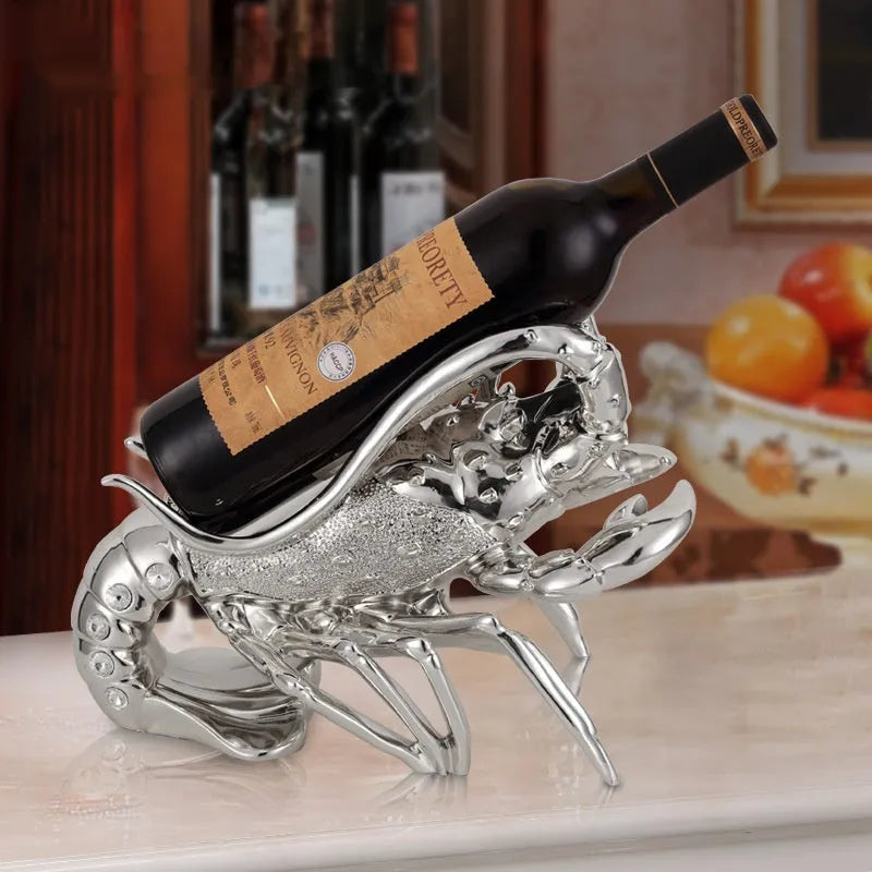 Lobster-shaped wine rack ornament in metallic rose gold or silver finish displaying wine bottle