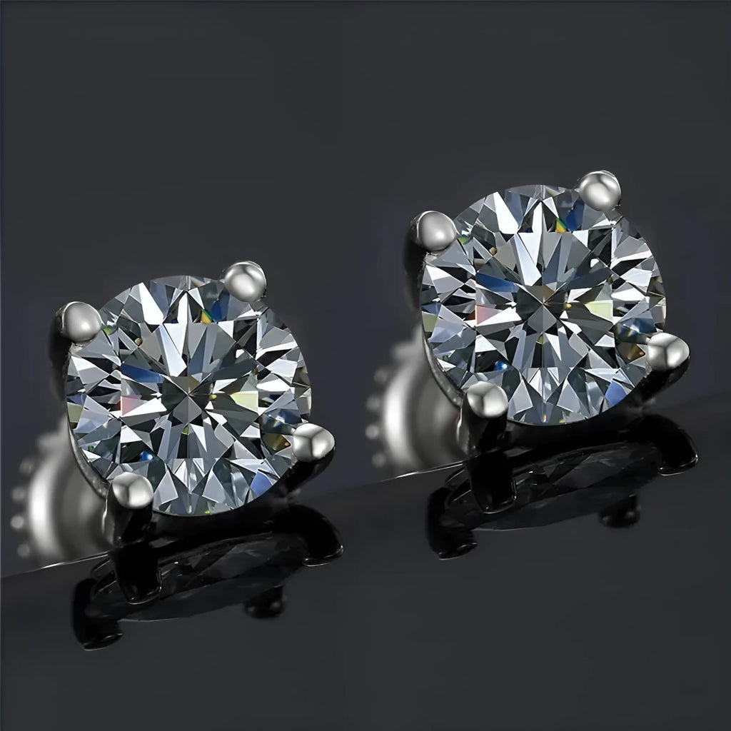 Screw-back moissanite stud earrings in sterling silver with geometric design and four-claw setting