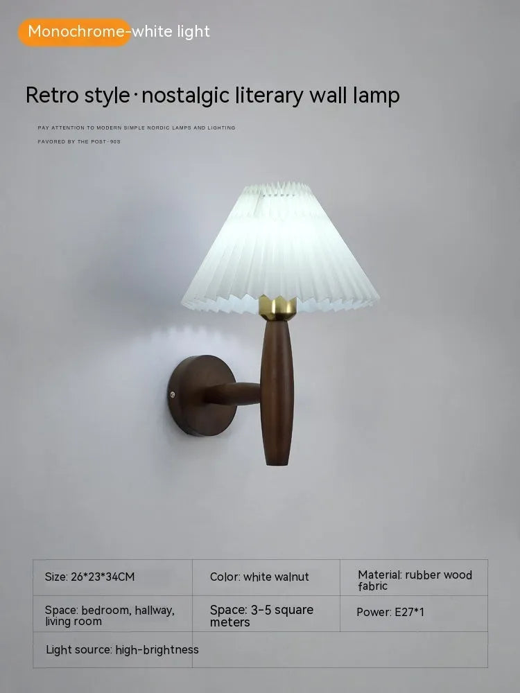 American retro rubber wood and fabric wall lamp in walnut finish on a wall.