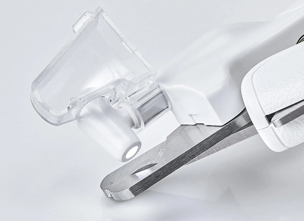 White LED pet nail clippers for dogs and cats with a transparent safety guard and leather-like handle.
