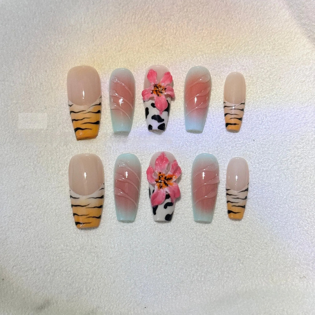 Zebra pattern lily hand carving nail art set with embossed flower and leopard print designs.