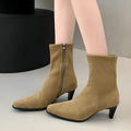 Brown square toe mid heel boots with side zip on a white background.