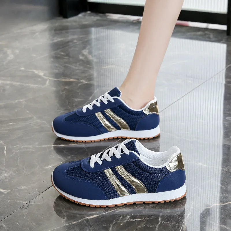 Blue women's casual sports shoes with cross shoulder straps and a round toe.