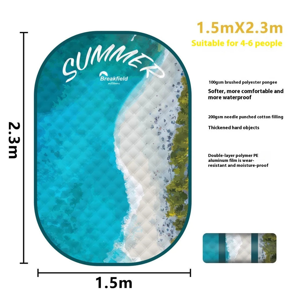 Waterproof ultrasonic thickening picnic mat in seasonal colour on grass, showing textured brushed fabric and moisture-proof backing