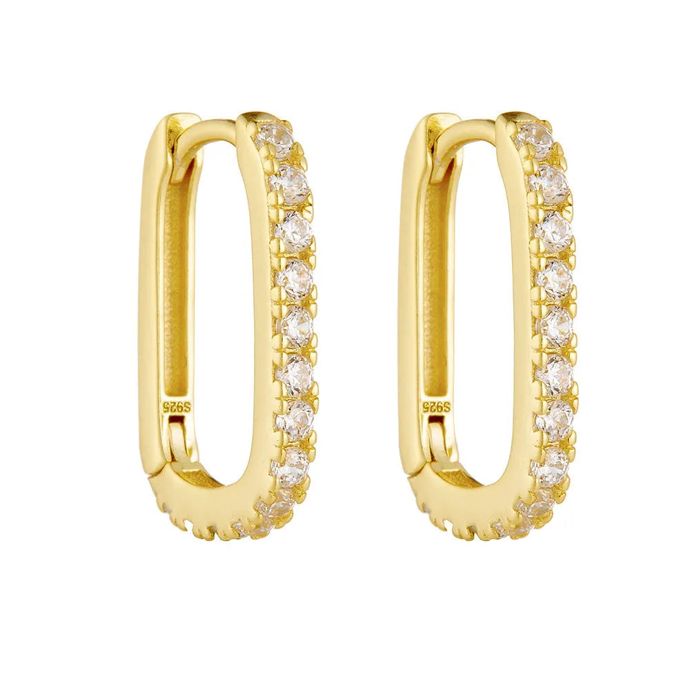 S925 sterling silver oval zircon ear clips on ear, shown in yellow and white colour options.