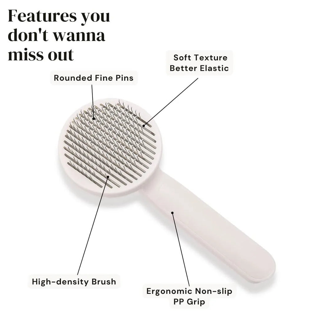 Blue self-cleaning pet grooming slicker brush with ergonomic rubber handle on a table