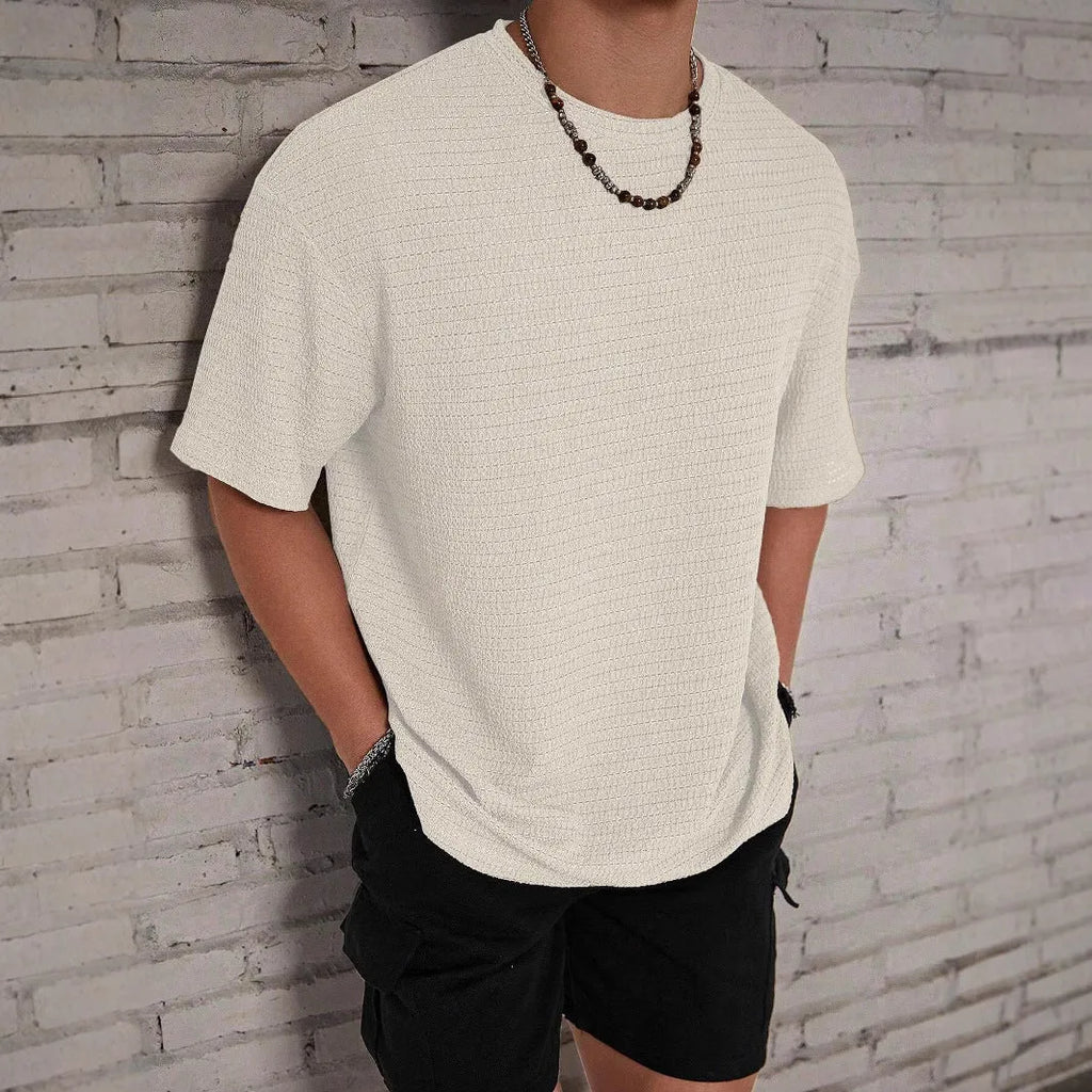 Men's slim fit polyester t-shirt in loose hollow construction showing round neck and short sleeve design