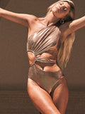 Women's one-piece swimsuit in gold with a backless design.