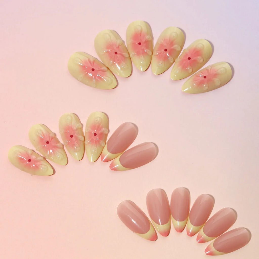 Simple fake nails with pink and white cartoon 3D flowers, shown with jelly glue tube and filing strip.