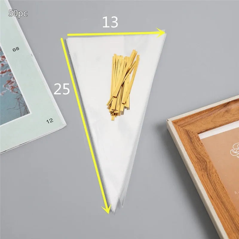 Clear triangle-shaped plastic packaging bag with a twisted wire tie closure on a white background.