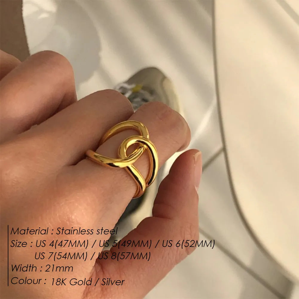 Adjustable open knot ring for women in stainless steel, showing geometric U-shape design in gold or steel colour.
