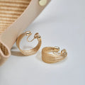 Multi-layer geometric earrings in gold and silver with stud and clip style options
