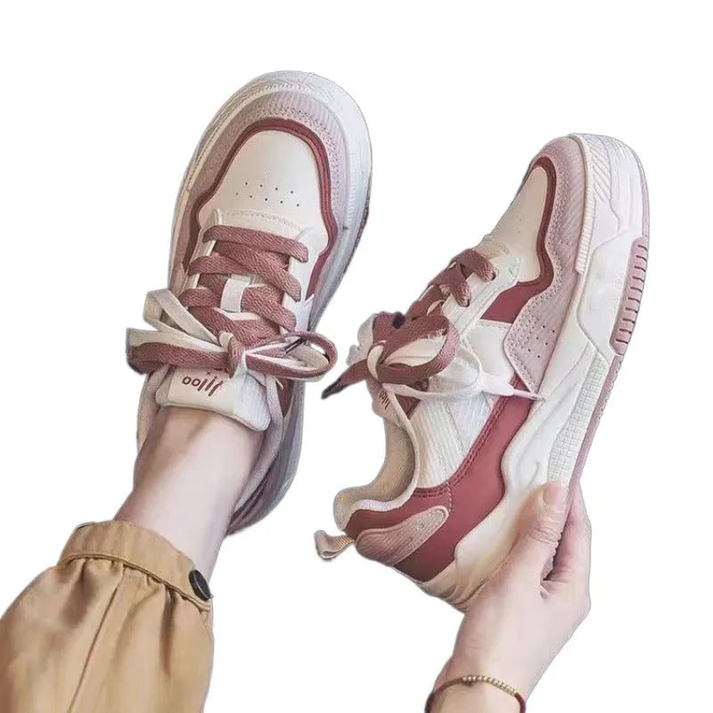 Pink and milky white low-top rubber sole sneakers with height increasing function
