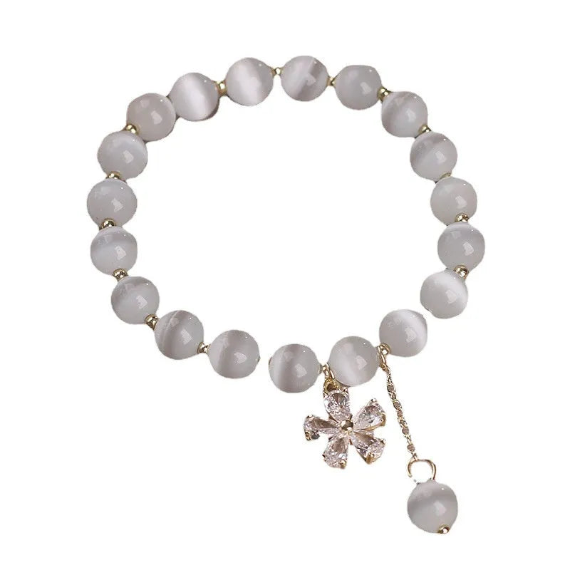 White cat's eye crystal bracelet with flower tassels and morganite safety buckle pendant
