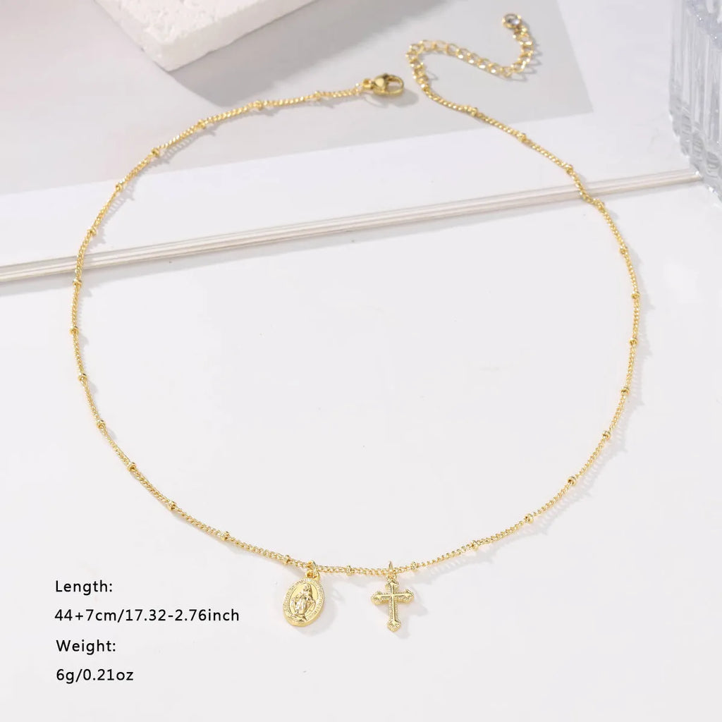 Virgin Mary geometric cross necklace in gold colour with simple styling