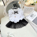 White polyester princess-style waltz gauze skirt for a small dog on a hanger.
