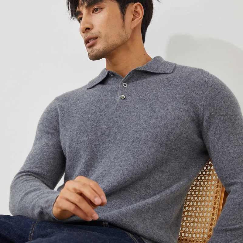 Man wearing a sapphire blue loose-fit cashmere polo collar pullover sweater.