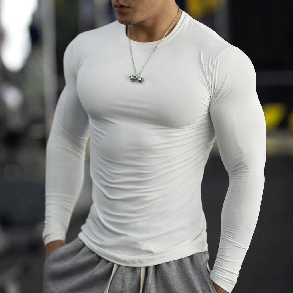 Men's black long sleeve fitness tights in slim fit for running and gym workouts