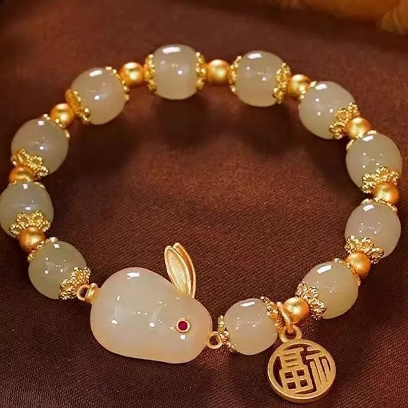Women's green fu jade hare bracelet with black cord and lily motifs